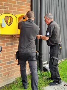 Defibrillator being installed