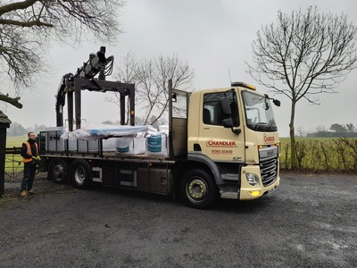 Chandlers Building Supplies off loading donated materials