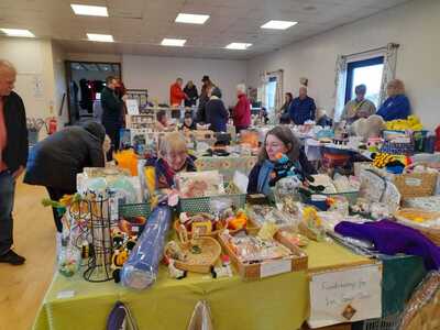 Barry and Liana from BBC Essex talking to Clive and stallholders about the clue