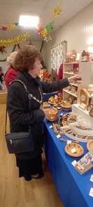 The Mayoress Councillor Jackie Galley looking closely at the wood turning items from John Bishop