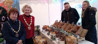 The Mayor of Chelmsford Councillor Janette Potter and Mayoress Councillor Jackie Galley posing for a photo at Waggles Raw Treats stall