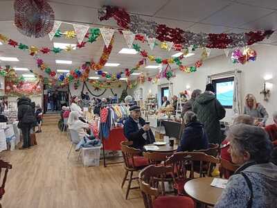 Customers enjoying some wonderful bacon/sausage sandwiches with a cuppa!