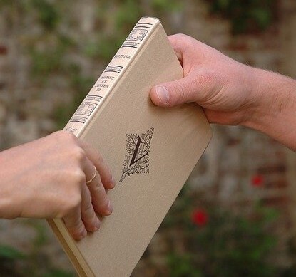 Book being handed over