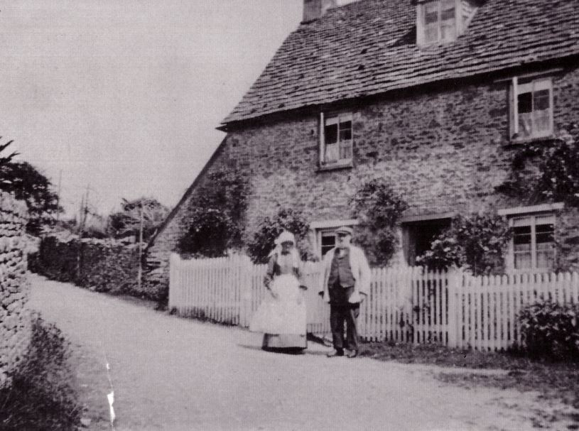 Duntisbourne Abbots - 'Partridges' circa 1905 with Mr and Mrs Jude Partridge stood to the front