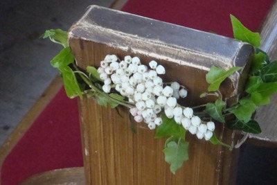 Flowers on the pew end.