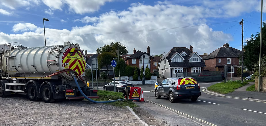 Southern Water tanker with hose going into drain