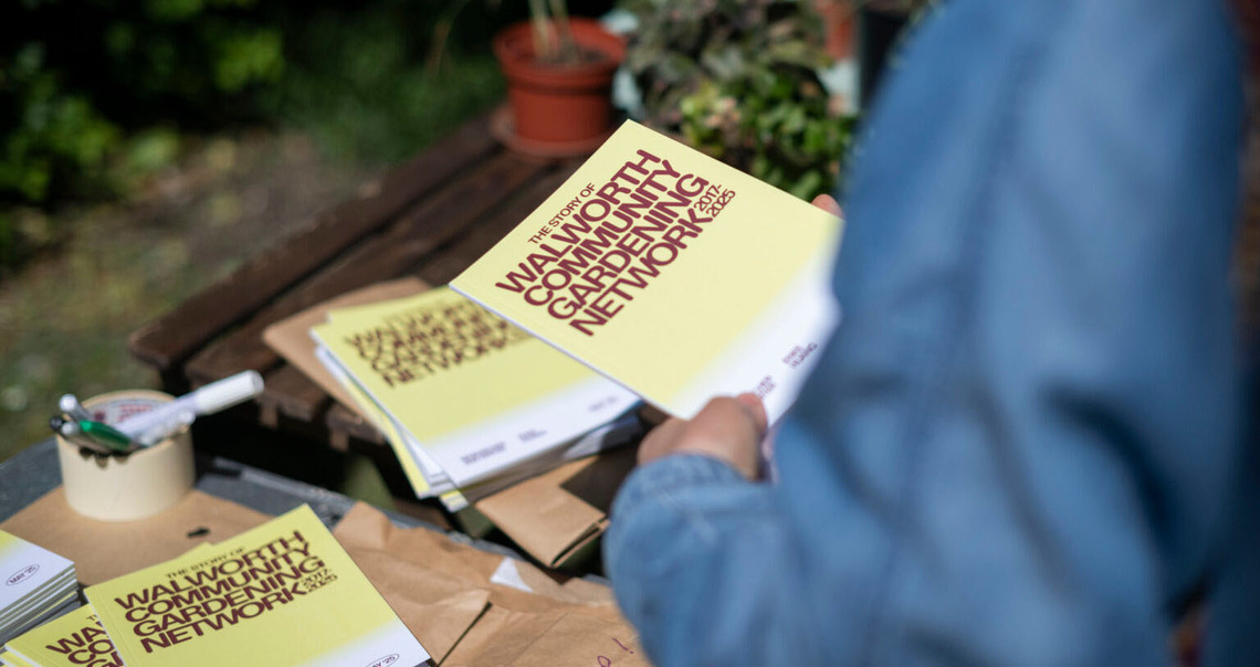 A photograph of the WCGN publication at a community gardenning event