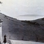 A second view down the valley from the Lodge. The ladies are standing outside the main door on the north side of the house.Their dresses suggest a late 19th or early 20th century date. The Plymouth breakwater, completed many years before in1841,can again be seen in the Sound. A second view down the valley from the Lodge. The ladies are standing outside the main door on the north side of the house.Their dresses suggest a late 19th or early 20th century date. The Plymouth breakwater, completed many years before in1841,can again be seen in the Sound.