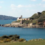 Staddon Point forms the northern side of Bovisand Bay. It's significance for defence was its commanding position overlooking the eastern entrance to Plymouth Sound. The first defensive structure was Staddon Battery (1845), which can be seen climbing up the cliff. Fort Bovisand (begun 1861; completed 1869) lies below and is now listed Grade II*. Its 23 granite casement are arranged in an arc to fire in a broad sweep, and it is the best preserved of Plymouth's coastal batteries. Updated in fire power at various times, the fort was still in commission in WWII. The concrete observation towers above the casements are WWII in age and rare. Decommissioned in 1956, the fort was later a diving school, but is now unused Staddon Point forms the northern side of Bovisand Bay. It's significance for defence was its commanding position overlooking the eastern entrance to Plymouth Sound. The first defensive structure was Staddon Battery (1845), which can be seen climbing up the cliff. Fort Bovisand (begun 1861; completed 1869) lies below and is now listed Grade II*. Its 23 granite casement are arranged in an arc to fire in a broad sweep, and it is the best preserved of Plymouth's coastal batteries. Updated in fire power at various times, the fort was still in commission in WWII. The concrete observation towers above the casements are WWII in age and rare. Decommissioned in 1956, the fort was later a diving school, but is now unused