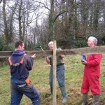 The MacBean brothers, facing the camera, erecting the protective fences