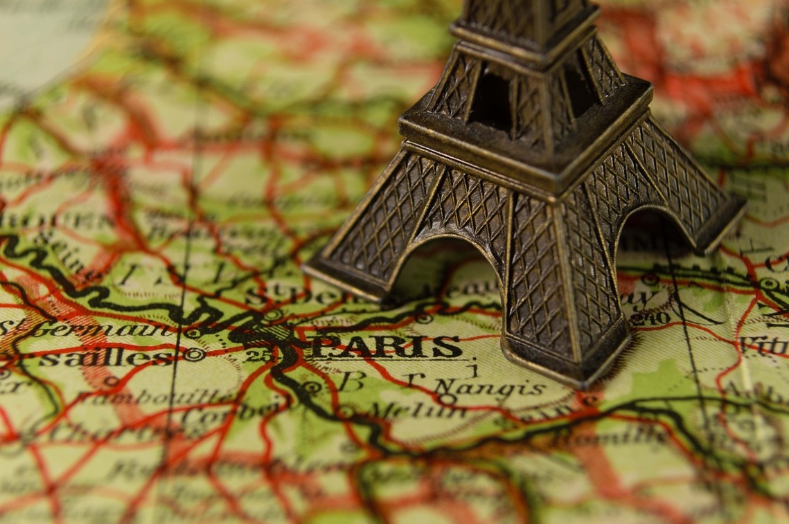 Model of Eiffel Tower on a map