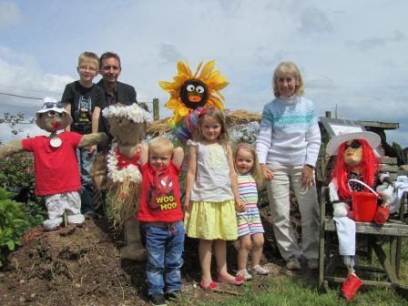 Open Day 2014 scarecrows with children and councillors